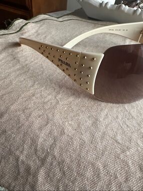 Prada Cream Frame Sunglasses with Gold Stud Accents